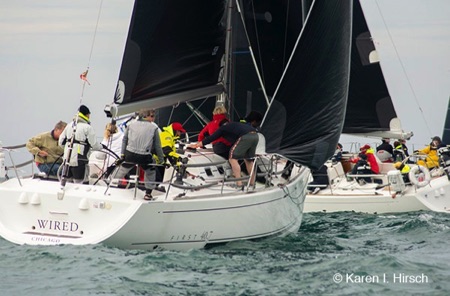 Two sailboats at a mark rounding